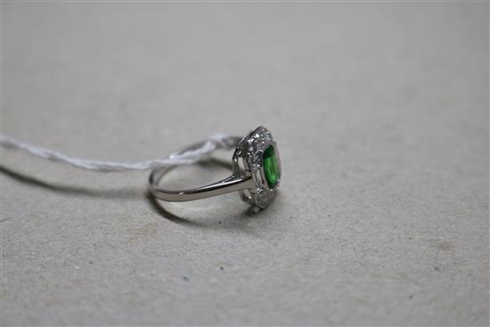 An 18ct white gold, green garnet? and diamond cluster ring, size N.